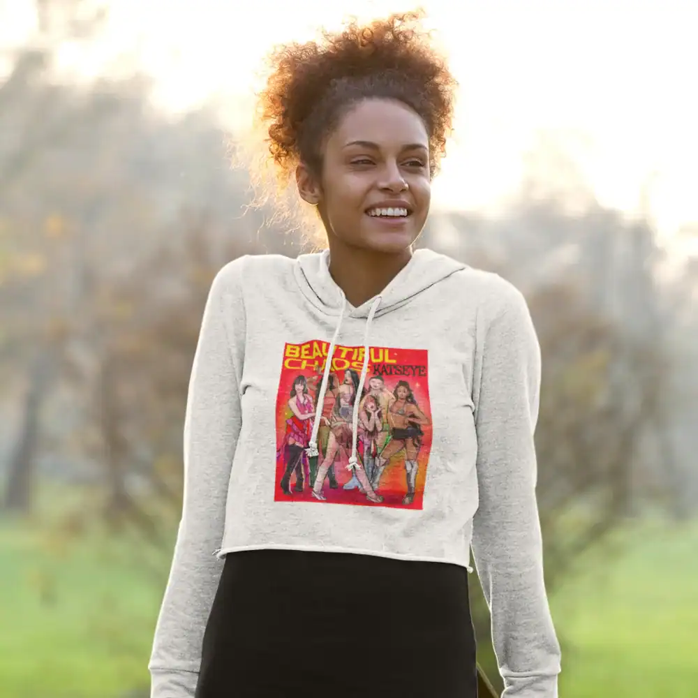 smiling black model wearing white cropped katseye hoodie